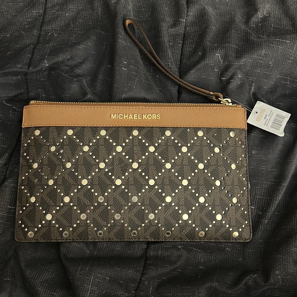Michael Kors large perf zip clutch new with tag.